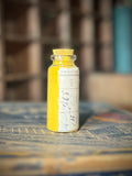 Apothecary bottle filled with yellow pigment PJ29